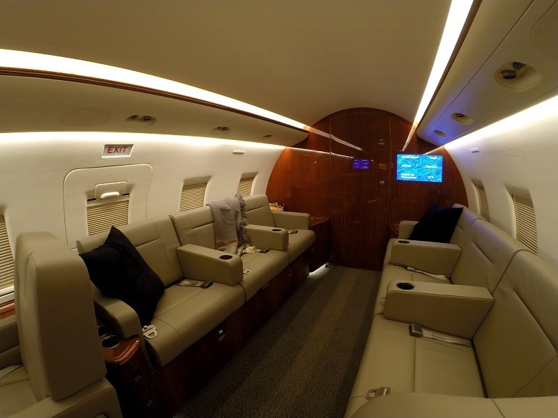 Private jet cabin with sofa and reclining seats for accessible travel from Philadelphia, Pennsylvania