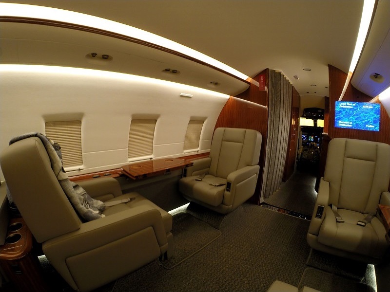Private jet cabin seating and table for wheelchair-accessible charter from Philadelphia, Pennsylvania